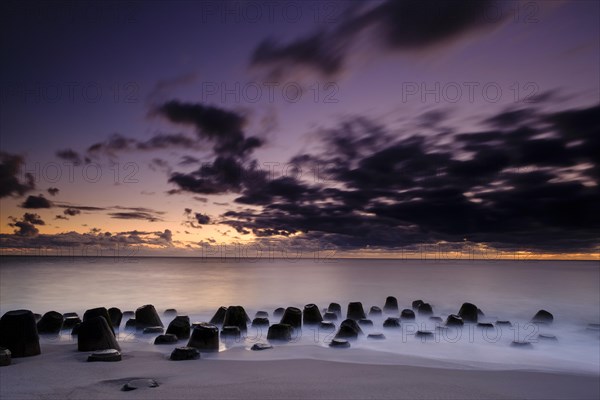 Concrete blocks as coastal protection on the beach of Hornum in the evening light