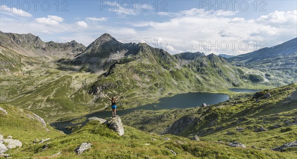 Hiker stretching arms in the air