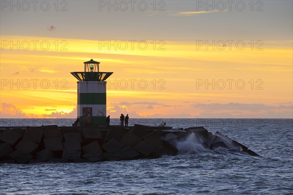 Small lighthouse at harbor entrance