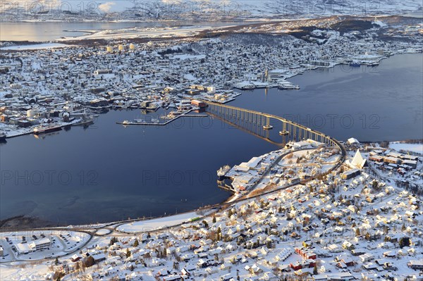 Snowy town with bridge