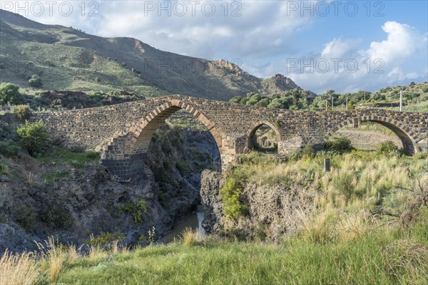 Medieval Saracens bridge crossing the river Simeto