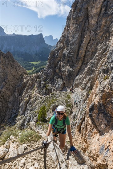 Woman on via ferrata to Nuvolau and Averau