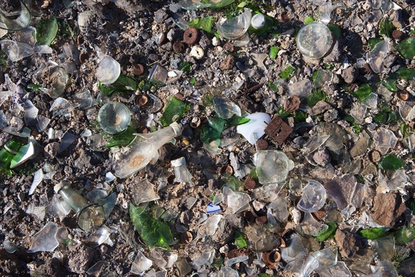 Broken glass and scrap metal at a dump