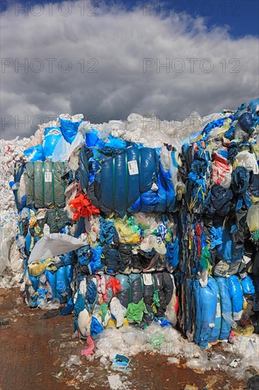 Plastic film in bales for recycling in a recycling plant