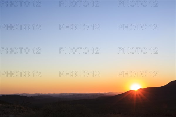 Staggered mountains at sunset