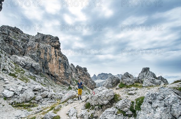 Hikers on the circular trail around the Sella Group