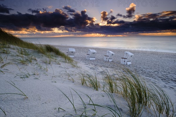 Beach chairs at the west beach of Hornum in the evening light