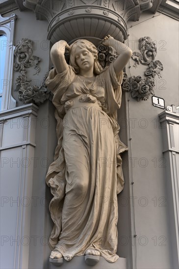 Art nouveau caryatid on corner house