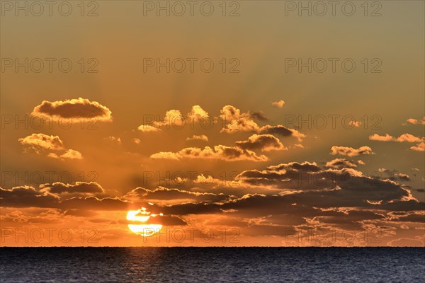 Sunset with cloudy sky above the North Sea