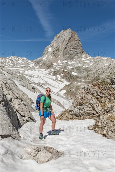 Hiker on the hiking trail to the Konigssee and the Wassereralm