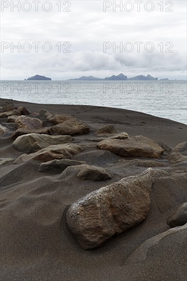Rock on dune of lava sand