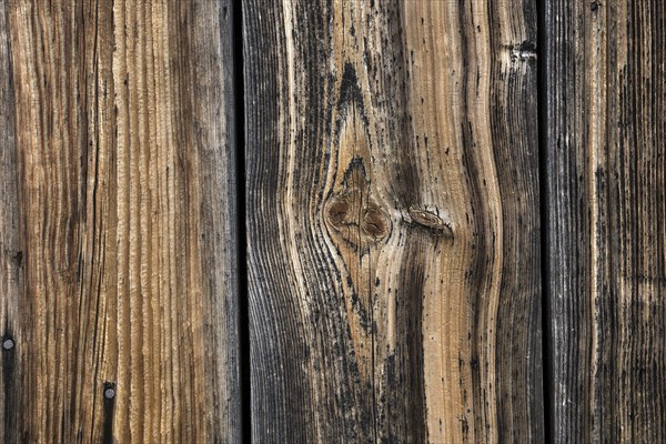 Old weathered wooden boards on wooden wall