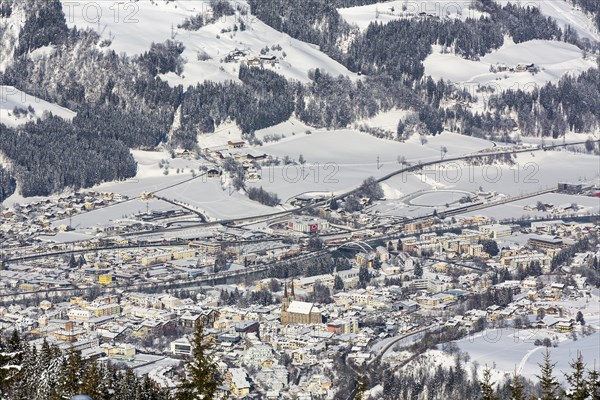 View onto St. Johann im Pongau with Salzach river in winter