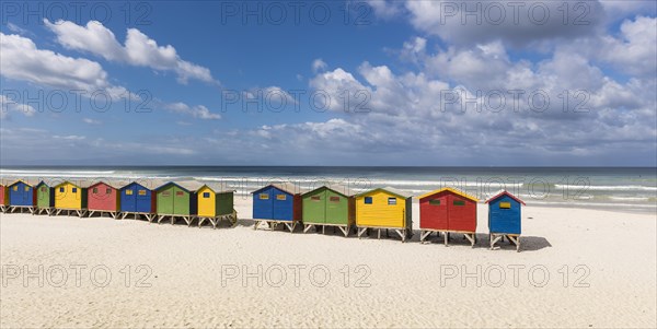 Colorful beach houses with cloudy sky