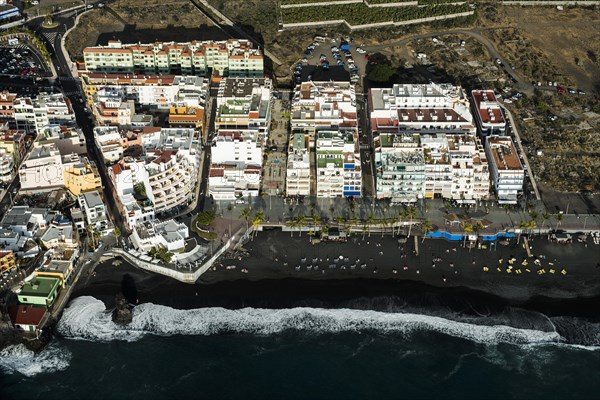 Surf on black lava beach