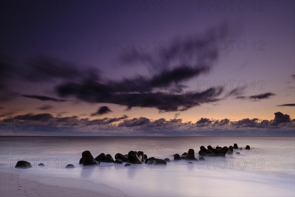 Concrete blocks as coastal protection on the beach of Hornum in the evening light