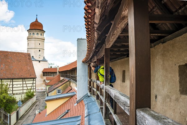 Young man on the old city wall