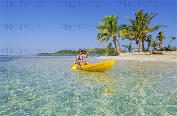 Woman in yellow kayak