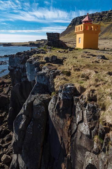Orange lighthousehouse