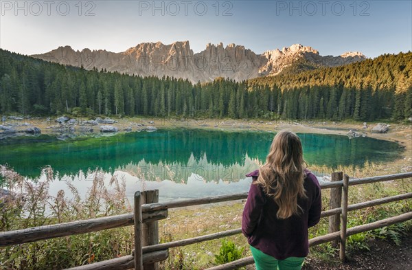 Woman overlooks Lake Carezza