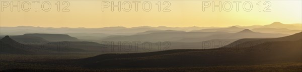 Staggered mountains in the sunset