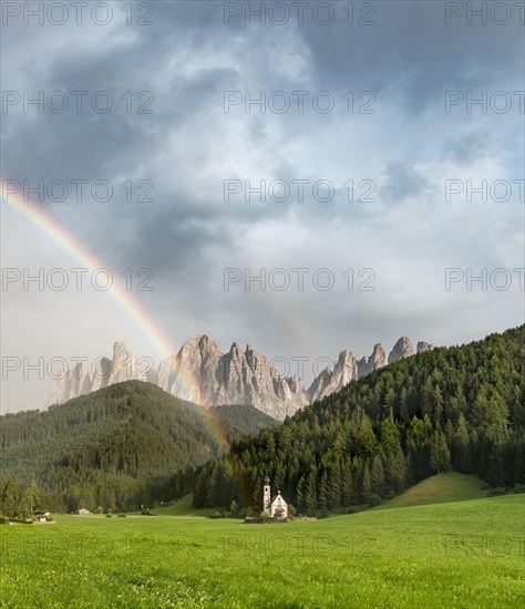 Rainbow in front of the church St. Johann in Ranui