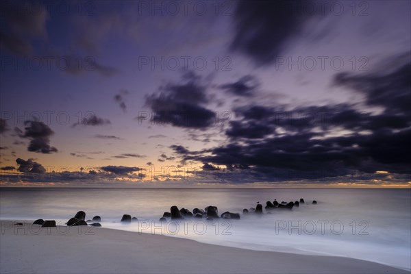 Concrete blocks as coastal protection on the beach of Hornum in the evening light