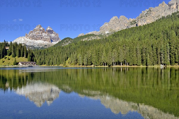 Three Peaks of Lavaredo southern walls water reflection in Lake Misurina