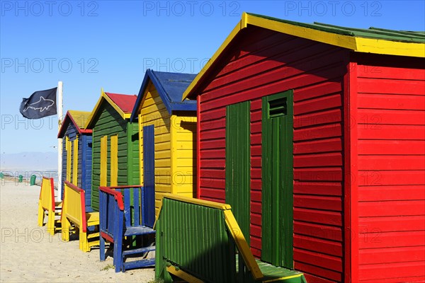 Colorful beach cottage with shark flag