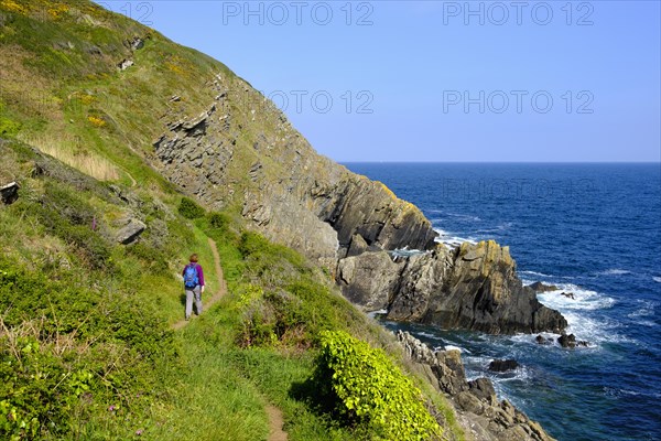 Woman hiking on Coast Path