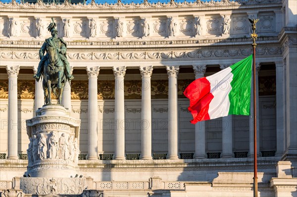 Italian flag drifting in front of Monumento Nazionale a Vittorio Emanuele II