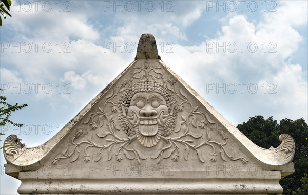 Relief of a grimace on an archway