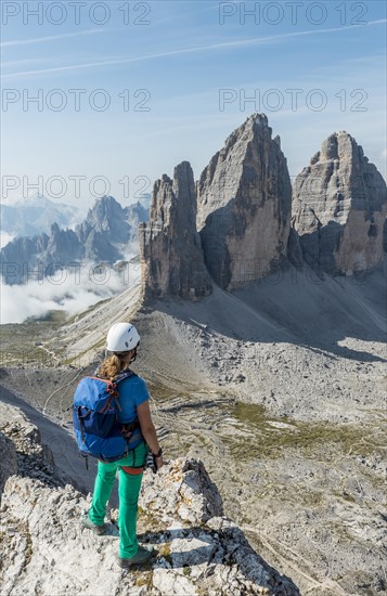 Trekker at the summit of the Paternkofel