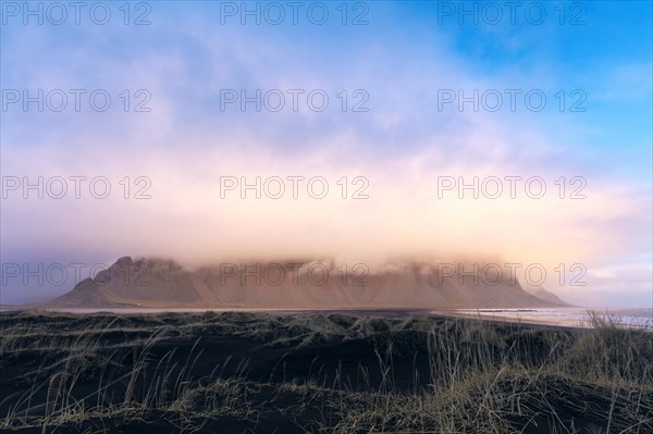 Mountain massif horn in clouds