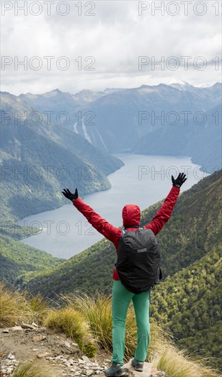 Female hiker looking at the South Fiord of Lake Te Anau