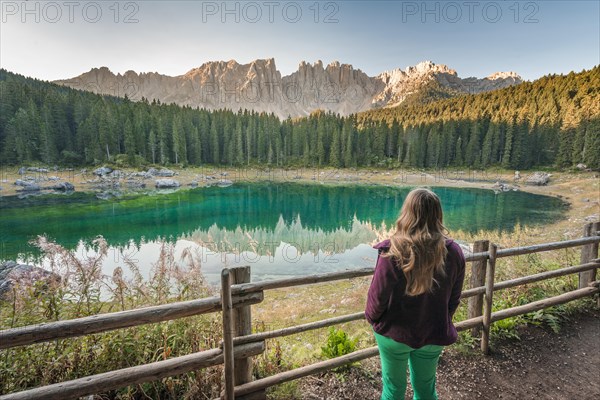 Woman overlooks Lake Carezza