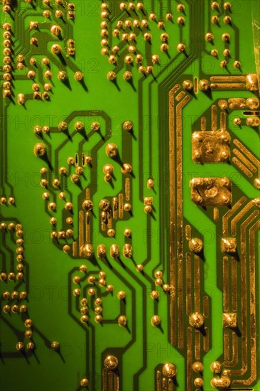 Green and gold computer circuit board close-up