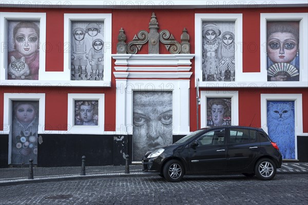 Wall of the house painted with various pictures