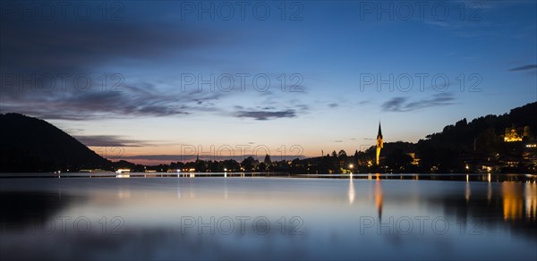 Lake Schliersee and St. Sixtus Parish Church at dusk