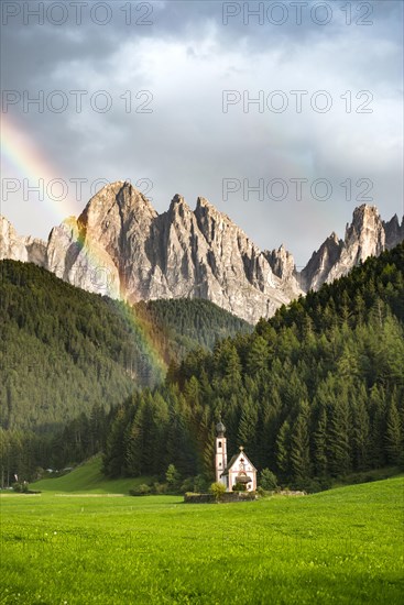 Rainbow in front of the church St. Johann in Ranui