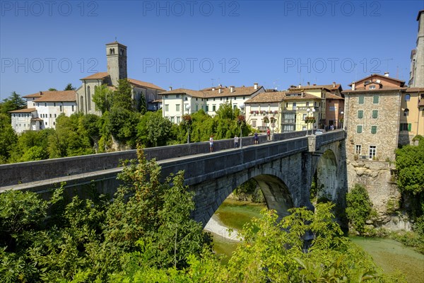 View over the river Natisone to the Campanile of the cathedral Santa Maria Assunta and the old town