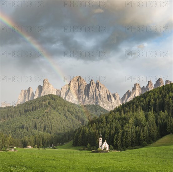 Rainbow in front of the church St. Johann in Ranui