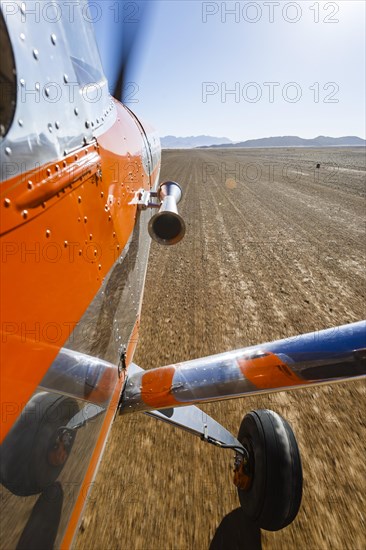 Cessna lands on sand track