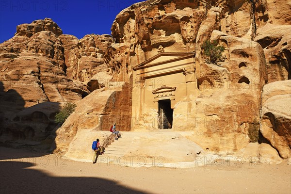 Hikers at rock-church in Little Petra