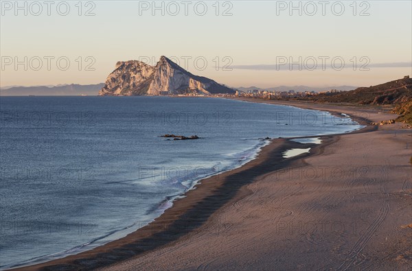 View of The Rock of Gibraltar and La Linea de la Concepcion as seen from the Mediterranean coast in the early morning light