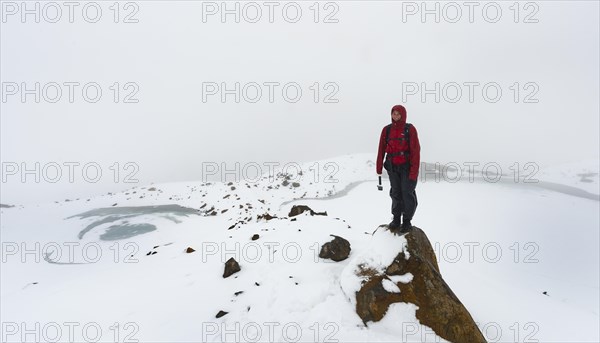 Hiker standing on rock