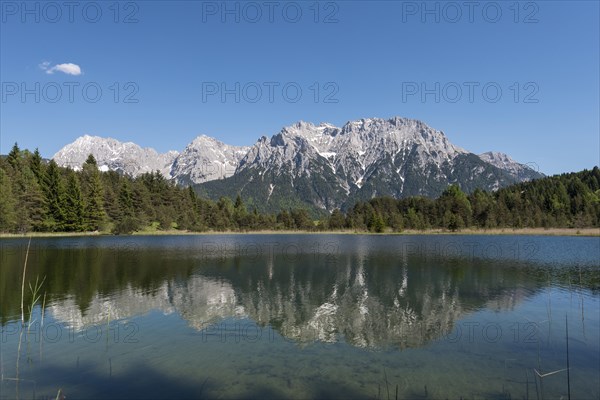 Western Karwendelspitze is reflected in the Luttensee