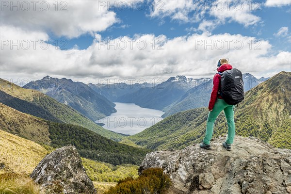 Female hiker looking at the South Fiord of Lake Te Anau