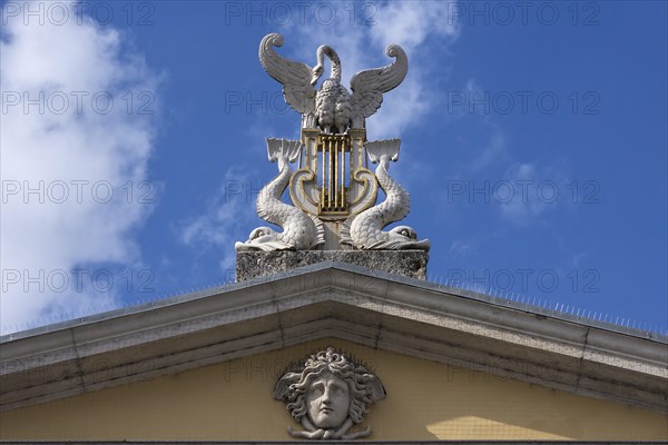 Figures on the roof of the City Theater