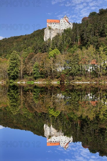 Castle Prunn reflected in the Rhine-Main-Danube Canal in Riedenburg